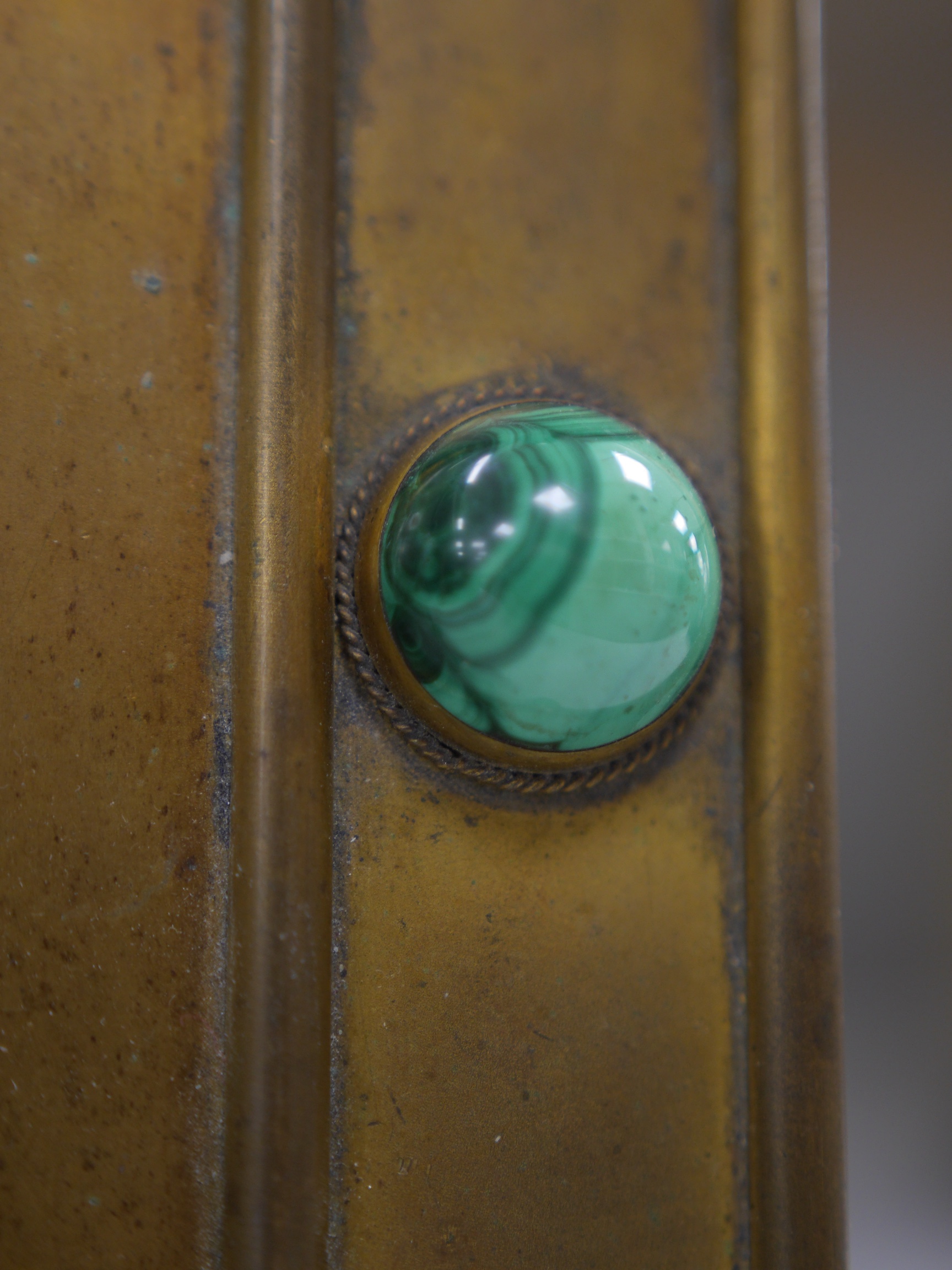 A 19th century malachite inset gilt brass blotter, 19cm wide x 26.5cm high. Condition - leather scuffed, brass tarnished